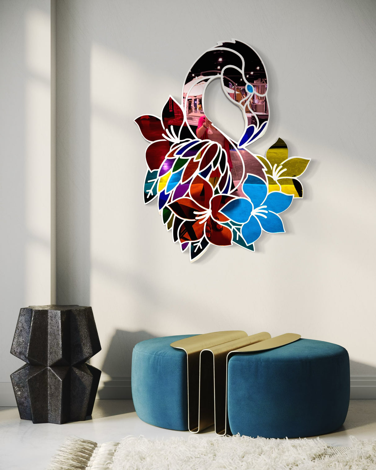 The uniqstiq Mirrored Flamingo wall art, with vibrant flowers, is displayed above a blue ottoman and geometric black side table in a sunlit room.
