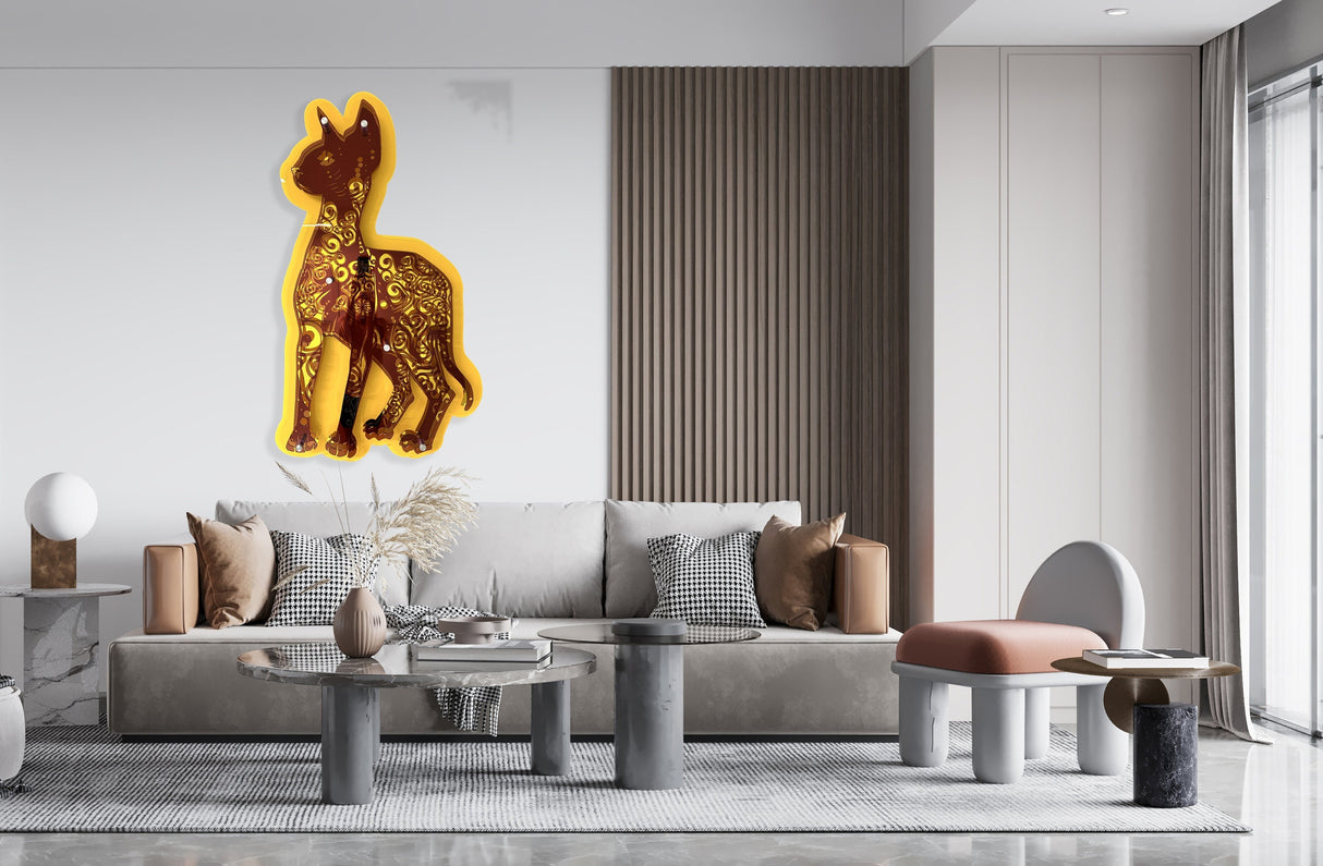 A modern living room with a beige sofa features uniQstiQs 3D Large Sphynx Cat Acrylic Wall Sculpture—mirrored and transparent—perfect as striking contemporary animal wall decor above the seating area.