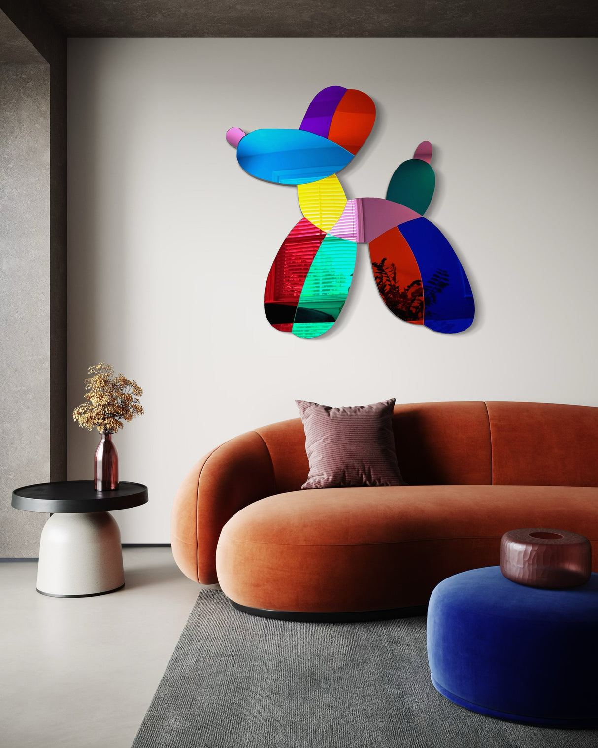 The uniQstiQ Mirrored Dog Balloon Dog Decor Acrylic Art Wall Sculpture adds a playful touch above an orange curved sofa in a modern neutral-toned living room, complementing mid-century modern decor.