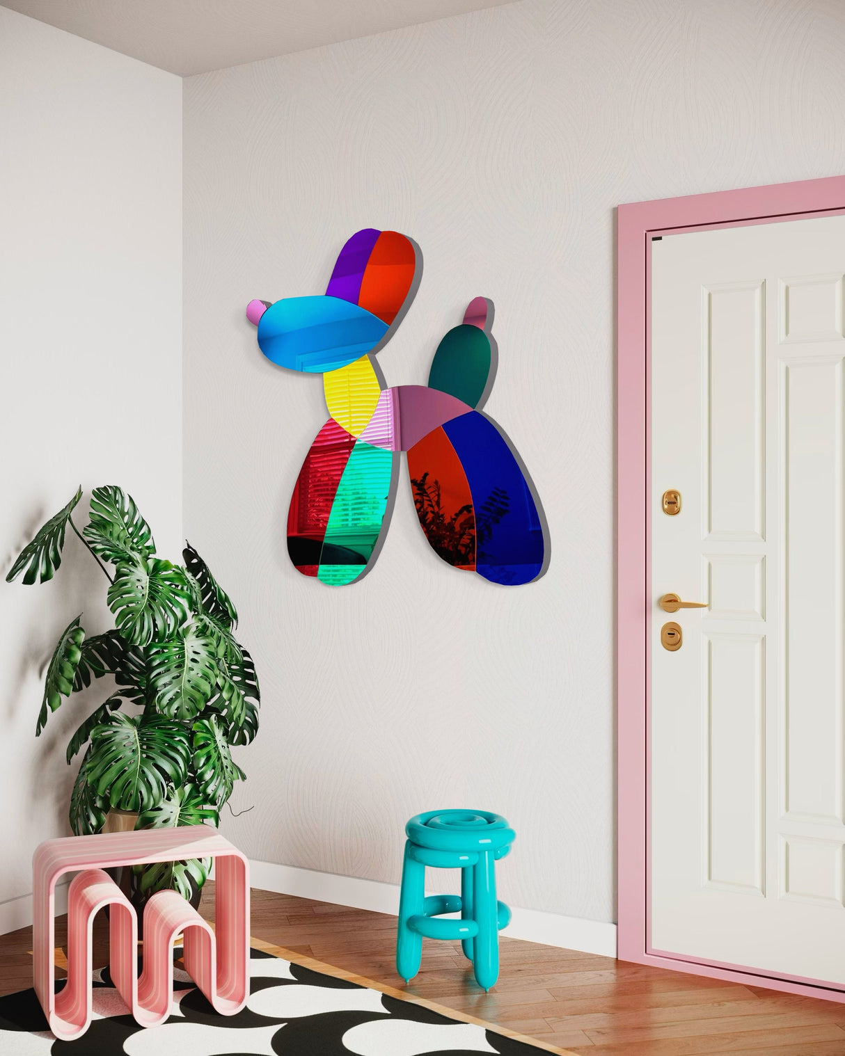 The uniQstiQ Mirrored Dog Balloon Dog Decor Acrylic Art Wall Sculpture, paired with a green houseplant, blue stool, and pink table, adds a playful touch to a bright entryway.